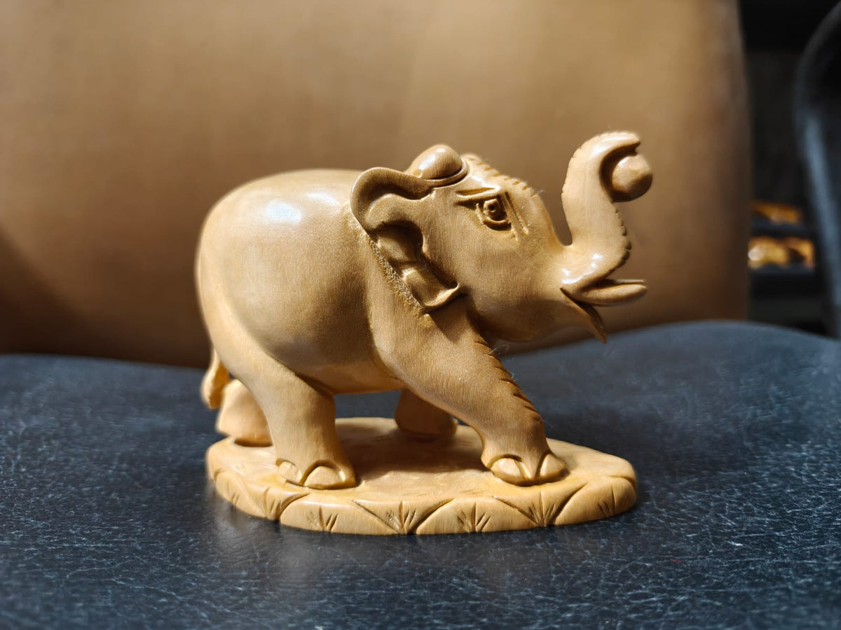 WOODEN TRUNK UP ELEPHANT WITH BALL