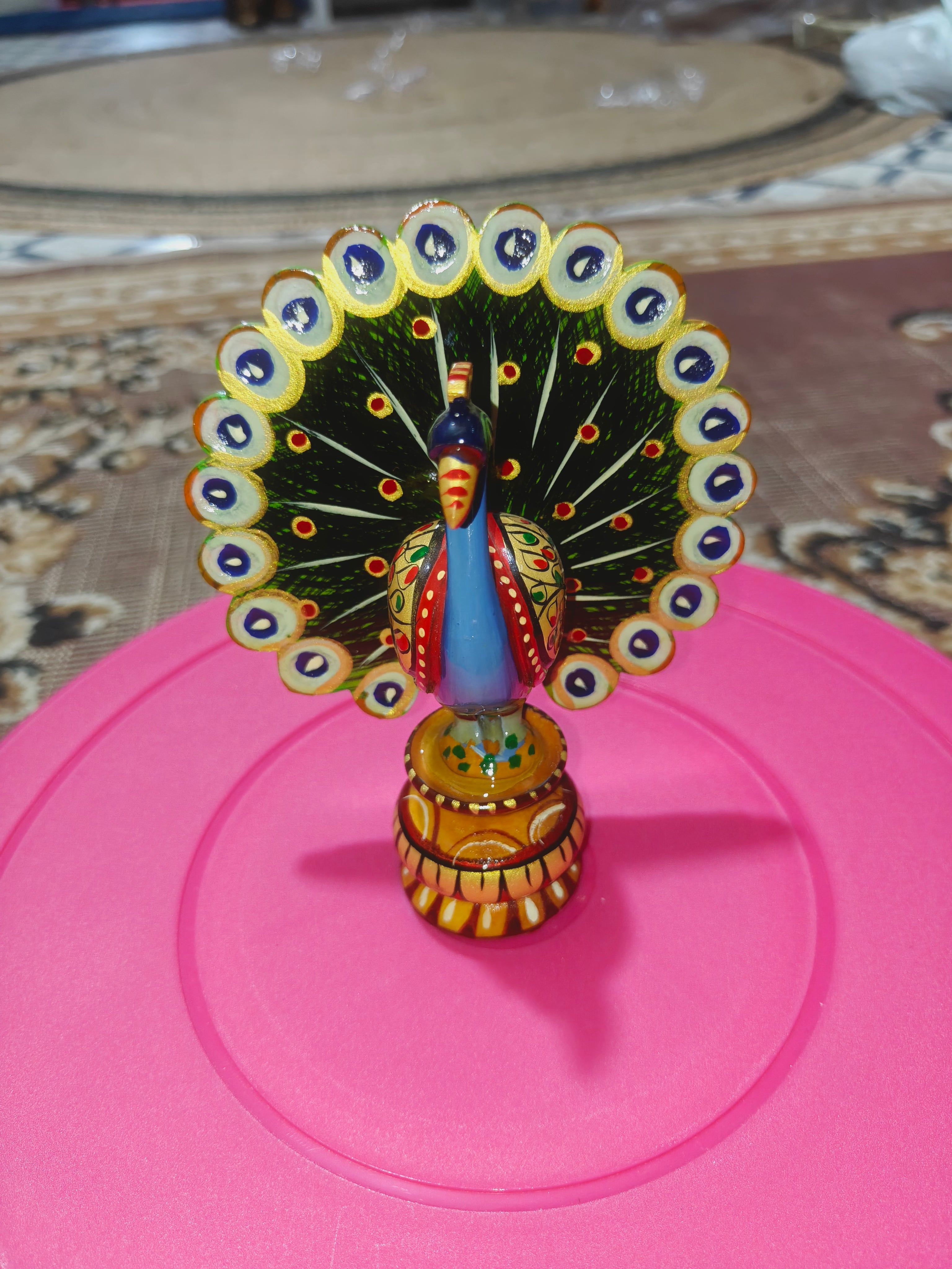 Wooden hand painted peacock