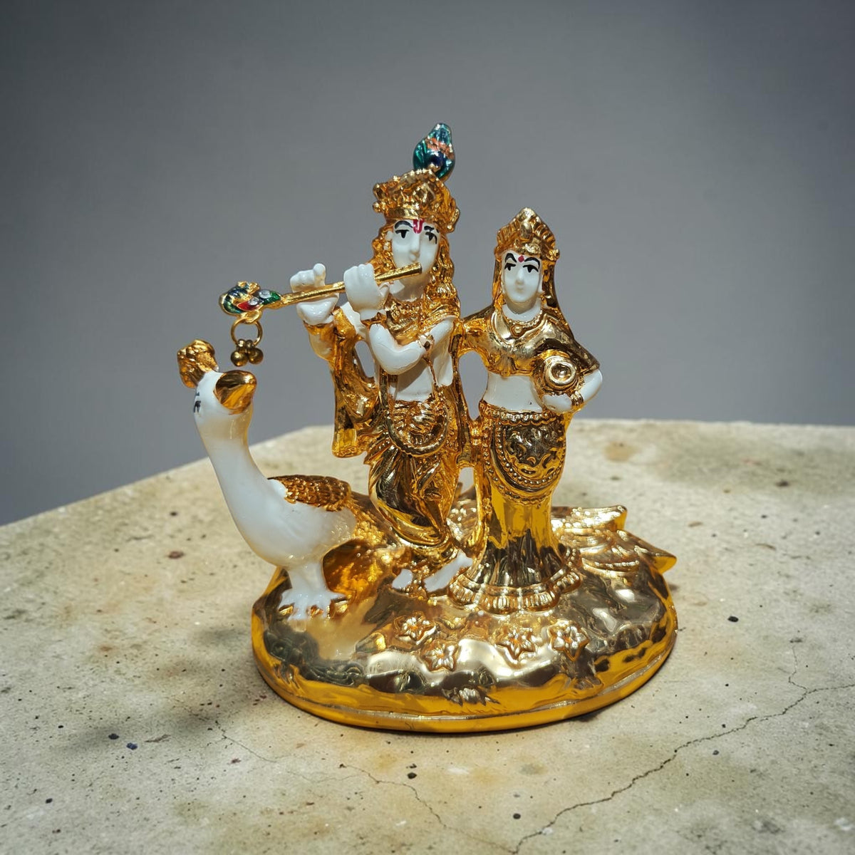 Radha Krishna with peacock gold plated statue